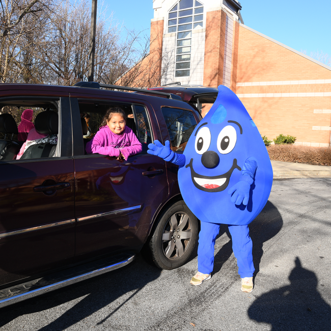 Willy water greeting a child