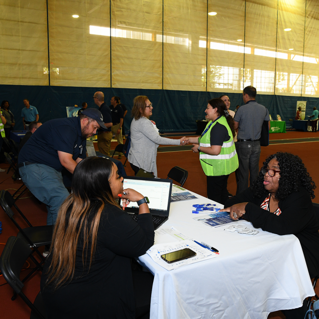 Greeting customers at the open house