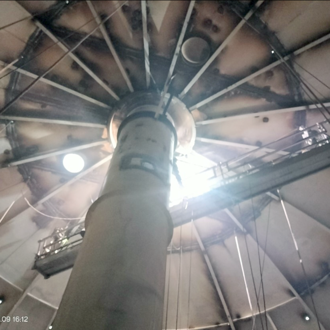 Tank interior roof repairs, roof rafter have been replaced, pits repaired by being welded and covered with covering plating.  The welders work off the scaffolding that is shown in the picture.