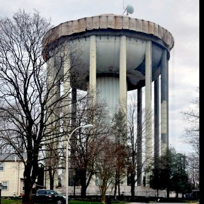 Absravise blasting and primer coat (gray) progress photo to the exterior of the tank.