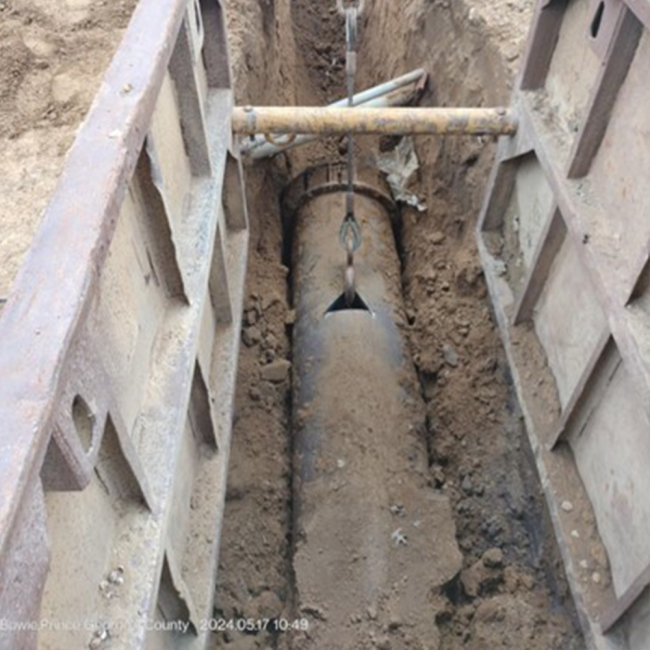 Currently, we're excavating the existing water line to the tank to replace it with a new main line. The existing line, installed when the tank was built, has reached the end of its service life.