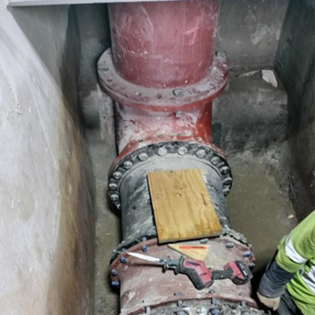  The new water line is being installed in the tank riser vault, where the main line connects to the elevated tank.