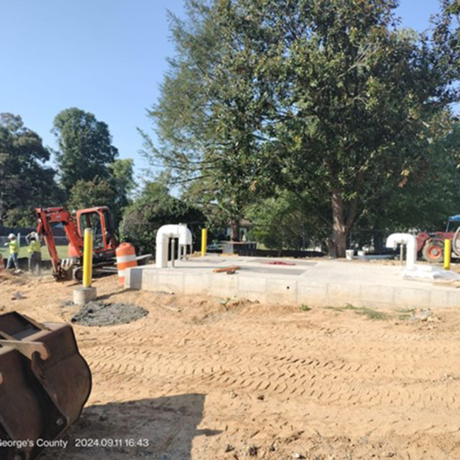 Altitude Valve Vault and Safety Bollards The altitude valve vault is completed, and the yellow safety bollards are installed. These bollards protect the vault and help equipment operators see it while working.