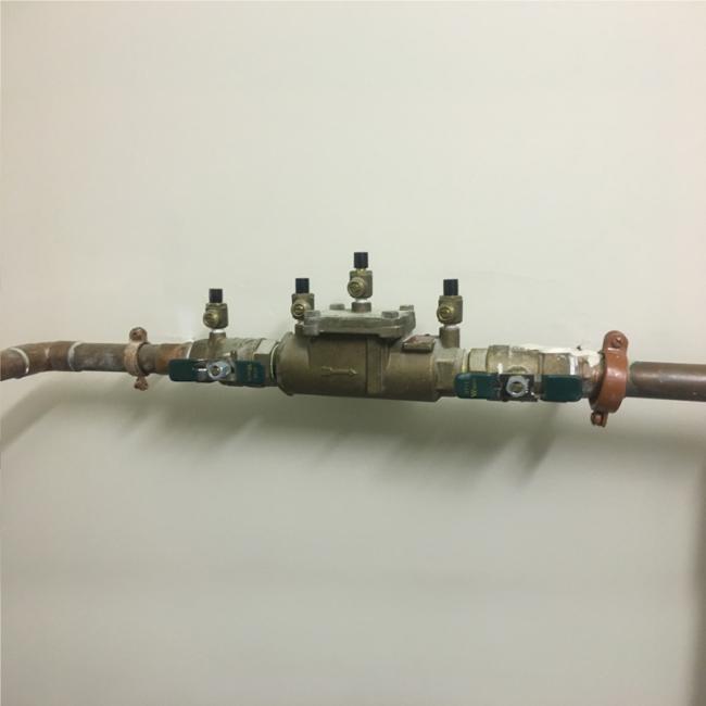 This is a reduced pressure zone backflow preventer assembly installed on a fire sprinkler system. 
